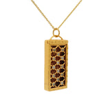 Gold cage and zircon necklace