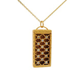 Gold cage and zircon necklace