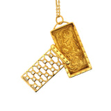 Gold cage and zircon necklace