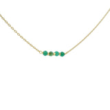 Golden necklace with natural stones and golden pearls