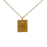 Gold horseshoe necklace with white zircon clover