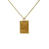 Gold horseshoe necklace with white zircon clover