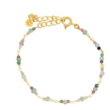 Golden bracelet with small natural stones