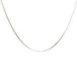 Gold necklace with a domed, stamped curb chain