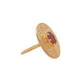 Gold ring engraved with flower and stone