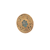 Gold ring engraved with flower and stone