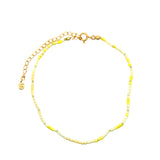 Chaine de cheville dorée en perles jaunes