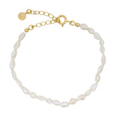 Golden bracelet with irregular cultured pearls