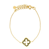 Gold bracelet and arabesque flower