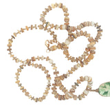 Collier doré disques de coquillage et scarabée vert 68 cm