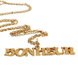 Gold necklace with hammered pendant "happiness"