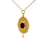 Gold necklace with rays and cabochon stone
