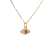 Gold necklace with hammered eye medal and stone