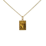 Golden necklace with seated woman plaque