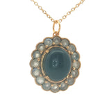 Gold necklace with cabochon flower and stones