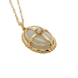 Collier doré original pendentif ovale pierre de lune et cage 50 cm