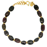 Bracelet with stones and golden discs