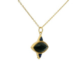 Gold necklace with faceted stone and triangles pendant