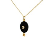 Gold necklace with unset stone, tassels and zircon