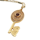 Collier doré clé tourmaline rose et zircons 60 cm