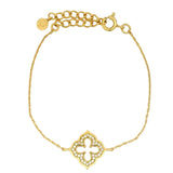 Gold bracelet and arabesque flower