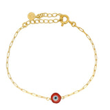 Gold bracelet and red eye