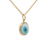 Gold necklace and flat eye