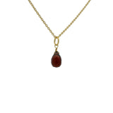 Gold necklace and faceted drop stone