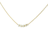 Golden necklace with natural stones and golden pearls