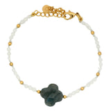 Bracelet with round stones, golden beads and stone clover