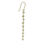 Boucles d'oreilles dorées pendantes avec peridot taillée brut