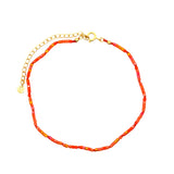 Chaine de cheville dorée et perles oranges