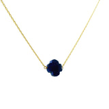 Gold clover necklace with faceted stone