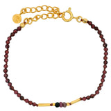 Gold rod bracelet and natural stones