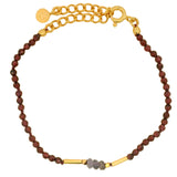 Bracelet doré avec iolite, grenat et tubes dorés