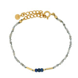 Gold rod bracelet and natural stones