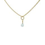 Golden necklace with small faceted natural stone