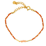 Gold rod bracelet and natural stones