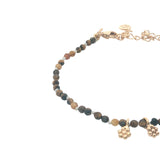 Bracelet with guilloche stones and flower tassels