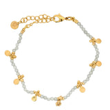 Bracelet with golden stones and pearls and golden tassels