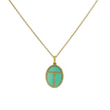 Golden scarab necklace with stone and zircons