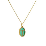 Golden scarab necklace with stone and zircons