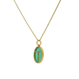 Golden scarab necklace with stone and zircons