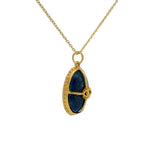 Collier doré cabochon pierre lapis , cage dorée et oeil 42 cm