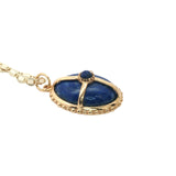 Collier doré médaillon lapis lazulis cabochon et cage dorée 50 cm