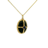 Gold necklace with cabochon stone and gold cage