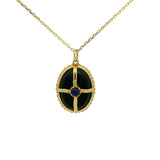 Gold necklace with cabochon stone and gold cage