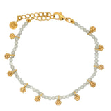 Gold bracelet with tassels and stones