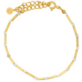 Golden bracelet with rods and natural stones