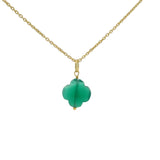 Gold necklace and stone clover